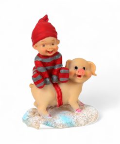 babynisse sidder på tværs af julegris 10 centimeter