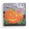 Servietten für Halloween mit Kürbis und Hexe auf Fahrrad