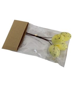 4 styk pastelgule påskeæg med sorte prikker der måler 3,5 x 2,5 centimeter på stilk på 9 centimeter